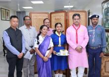 Presenting  Hon'ble CM (Prof.)Dr. Manik Saha with sticker flag of Tripura Bharat scouts & Guide